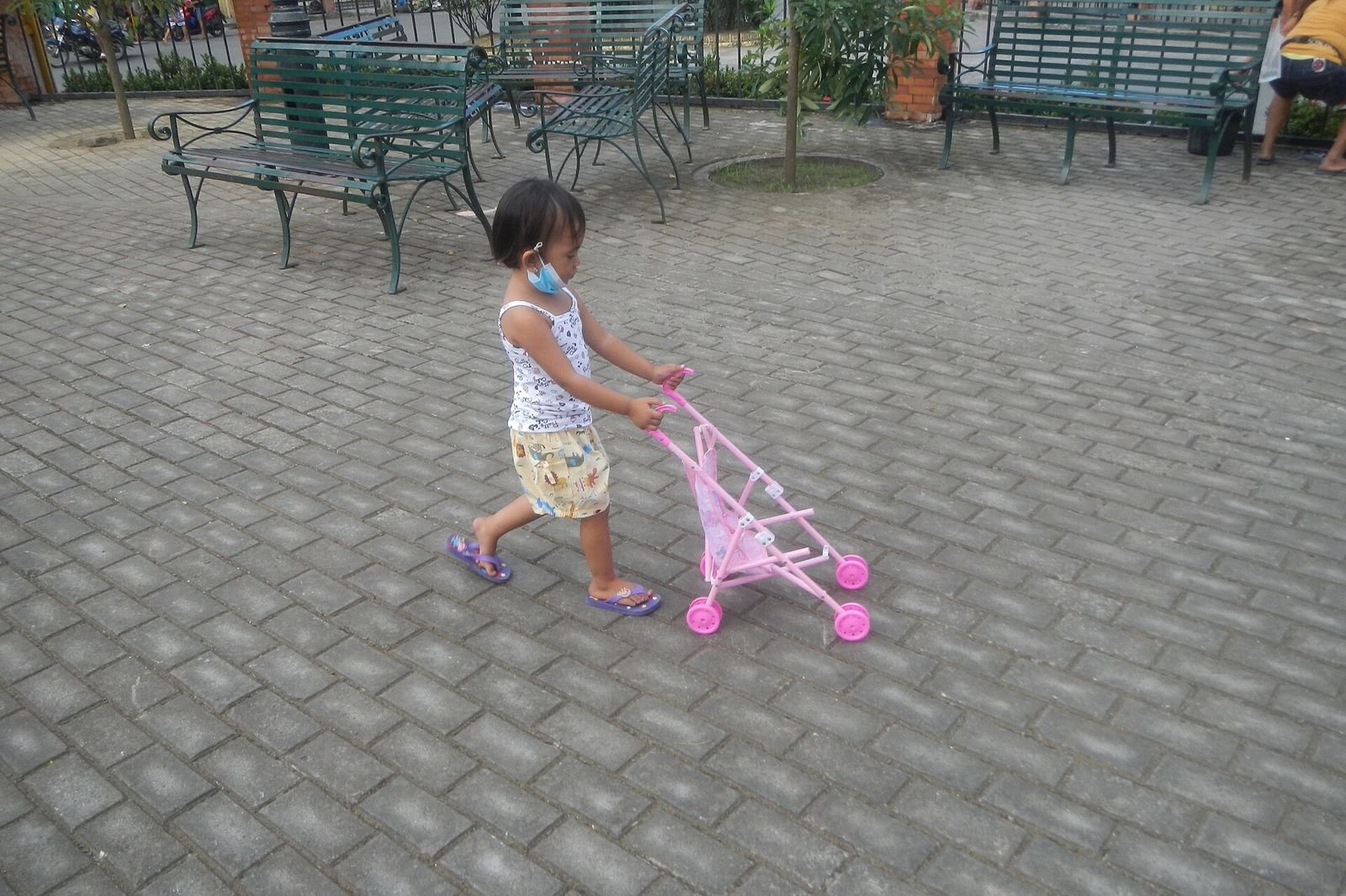 Girl with toy baby carriage 9